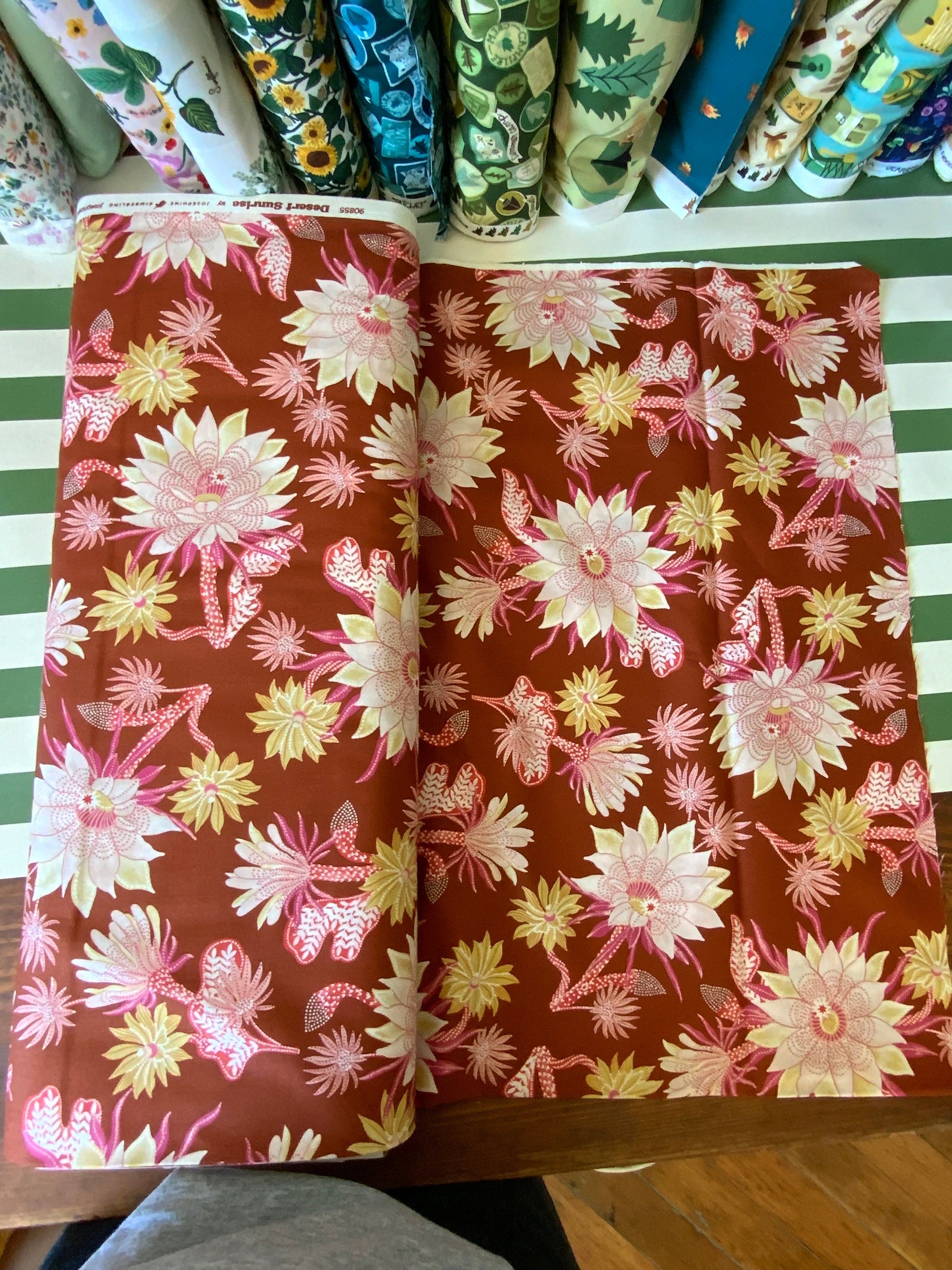 Desert sunrise 90855-32 Rust FIGO FABRICS Flower design with orange, pink, yellow
