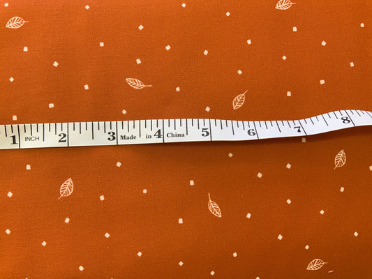 rust-cotton-fabric-savanna-sunset-leaves-print