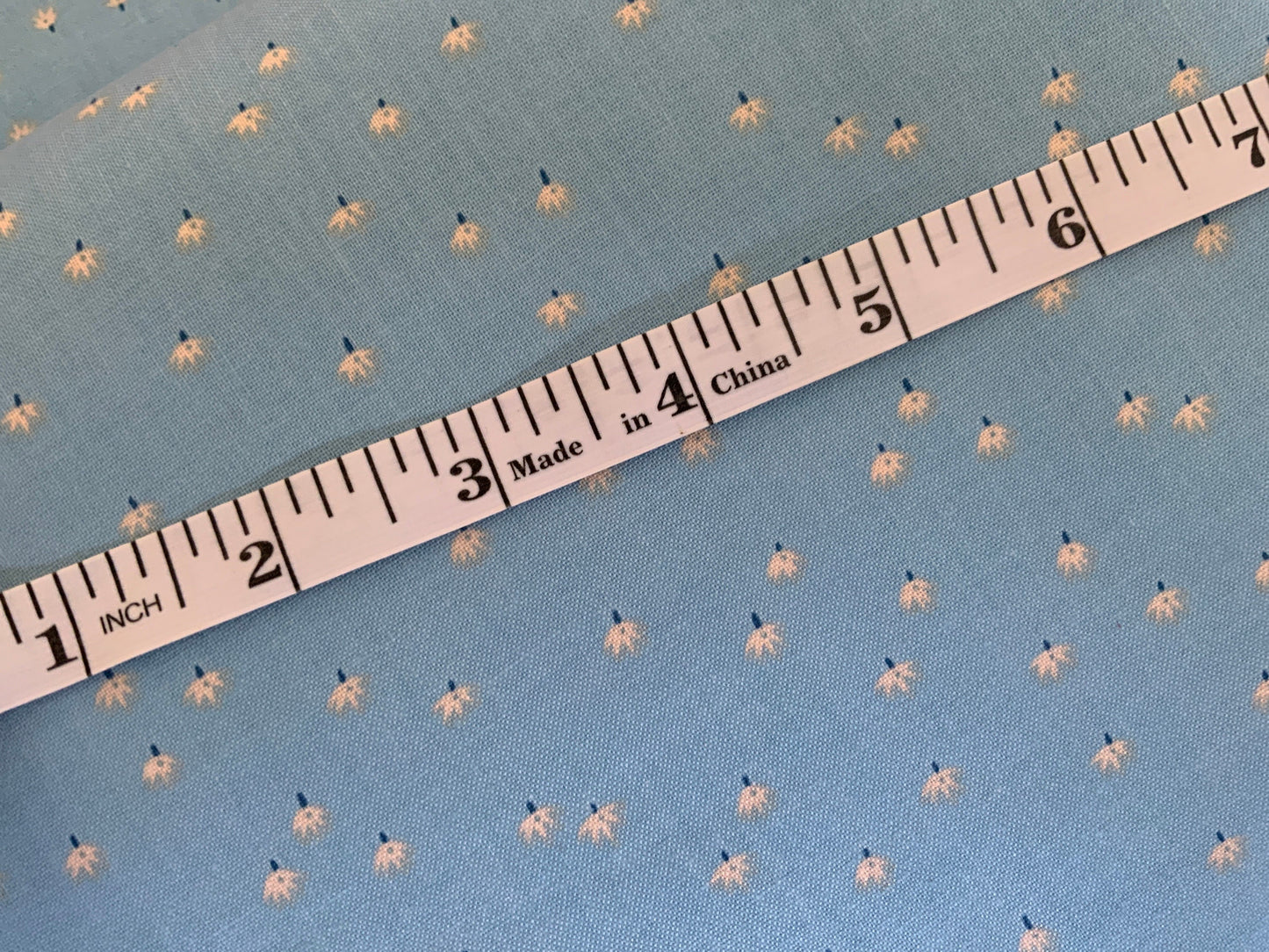 light-blue-floral-cotton-fabric-ditsy-mini-floral-design