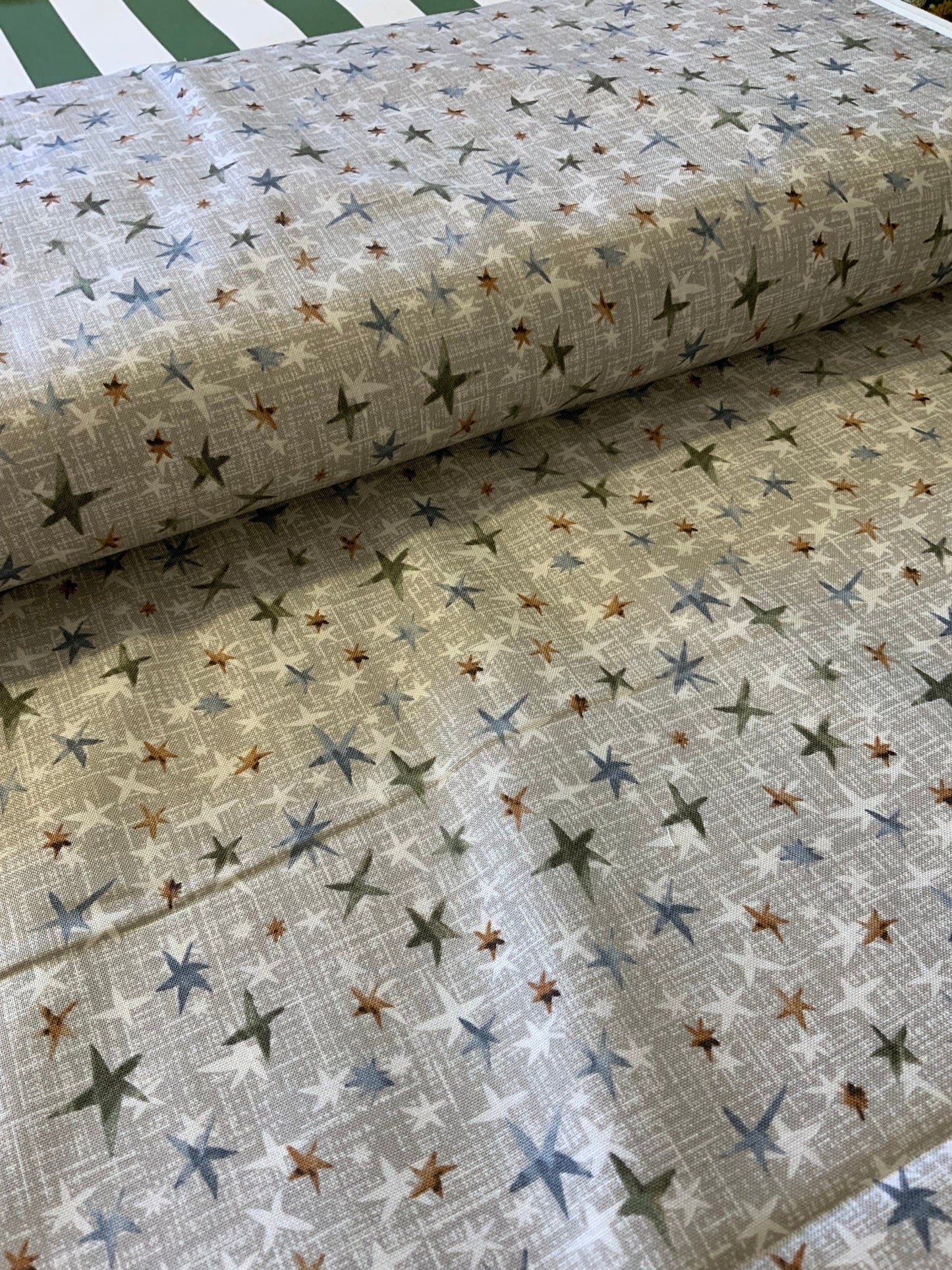 christmas-star-fabric-taupe-metallic-star-pattern-quilting-cotton
