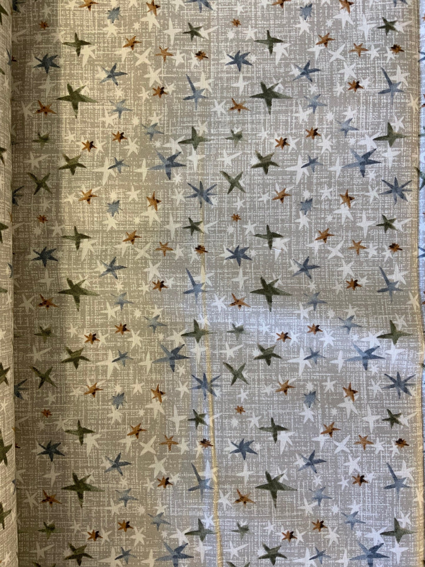 christmas-star-fabric-taupe-metallic-star-pattern-quilting-cotton