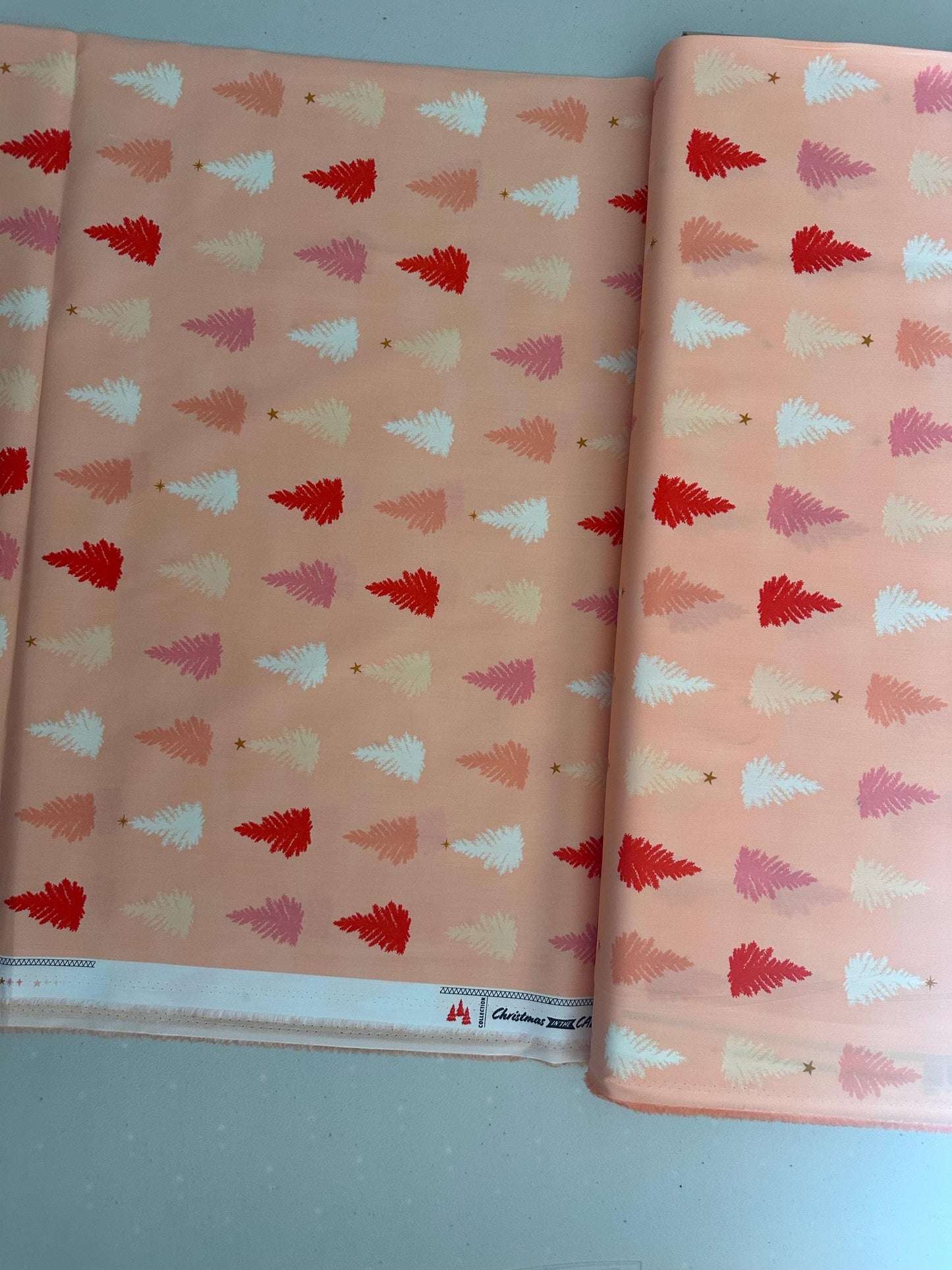 christmas-in-the-city-christmastime-joy-holiday-trees-pink-trees-on-peach