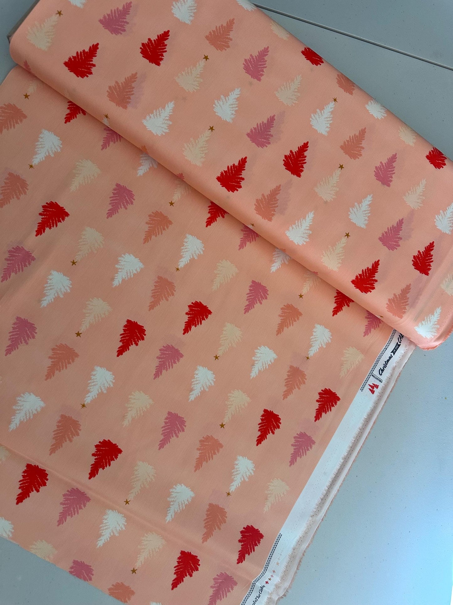 christmas-in-the-city-christmastime-joy-holiday-trees-pink-trees-on-peach